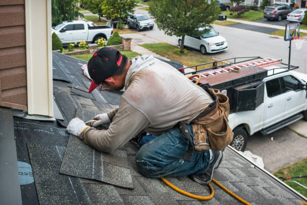 Professional Flat Roof Repair technician working in Poolville, TX